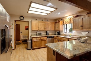 Granite new kitchen with Stainless steel appliances and all the kitchenware