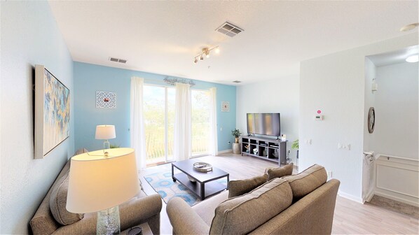 Discover relaxation at its finest in this elevated living area of the Orlando, Florida apartment. With a cozy sofa, Smart TV offering access to Netflix, and abundant natural light, every corner invites you to unwind. The thoughtful mix of textures.