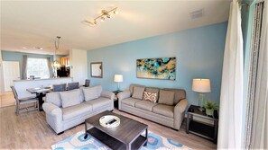 Discover relaxation at its finest in this elevated living area of the Orlando, Florida apartment. With a cozy sofa, Smart TV offering access to Netflix, and abundant natural light, every corner invites you to unwind. The thoughtful mix of textures.