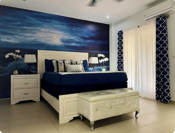 Master bedroom on the second floor with queen size bed