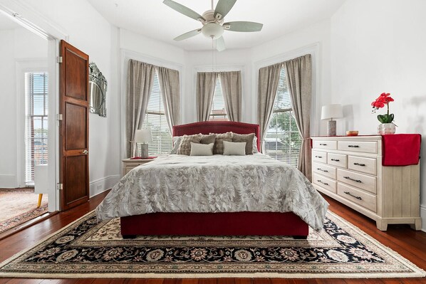 Master Bedroom (King Bed) in front of building w dresser and nightstand