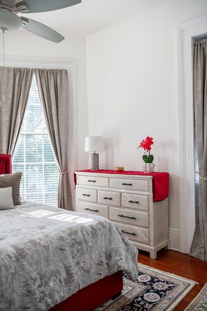 Front Master Bedroom King Bed and dresser portrait