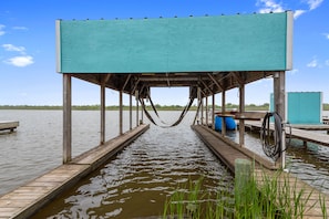 Boat house has a lift available for use and accommodates up to 26' boats.