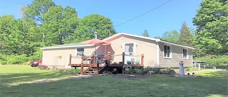 Cottage view with deck & large yard 