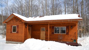 Exterior of cabin in the winter.