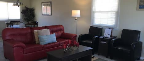 Living room with new sofa and chairs that make you feel right at home. 
