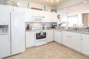 Our light & bright kitchen with new granite countertops wit lovely beach views.