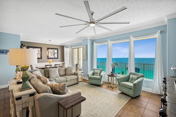 Large living room with plenty of seating, large ocean view and a 75” tv.  