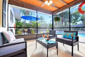 Relax under a shaded screened patio