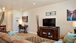 Main level family room featuring a large flat screen tv
