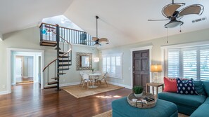 Living Room w/ Circular Staircase to "Kids Loft"
