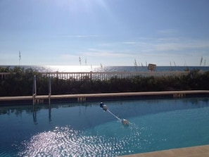 VIEW FROM THE BALCONY -- LATE AFTERNOON, -- THE POOL --THE GULF OF MEXICO