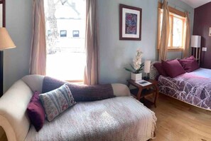 Master Bedroom features queen sized bed with chaise lounge and infrared sauna!