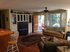 Living room view of front door entrance