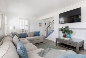 Living room with smart Tv and sofa bed