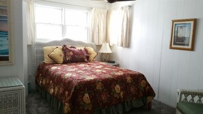 Master Bedroom with a Queen Bed and a small half bath.