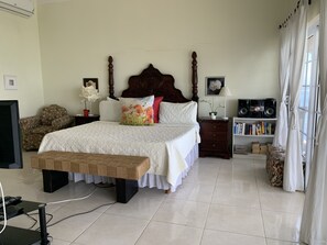 Master bedroom with king size bed and bathroom