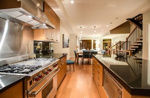 Modern kitchen including large island, top line appliances (Subzero, Wolf range)