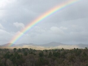 A portion of the panoramic view with a rainbow from the front wrap around porch!