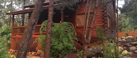 Covered porch with seating and swinging bench