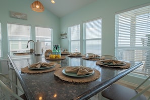 Relax or cook while soaking in the stunning beach views from both the living area and gourmet kitchen.