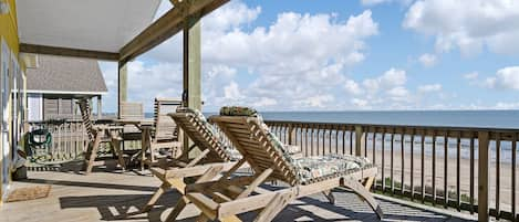 Deck with tall chairs and outdoor eating area