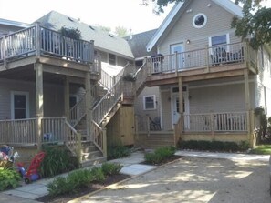 View of rear deck from parking area.  Deck for Apt. #1 is at lower right.