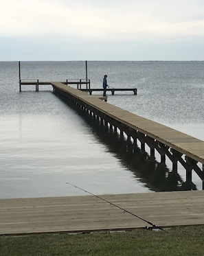 300 foot pier with space to dock a boat & 2 fishing lights at end - post Harvey