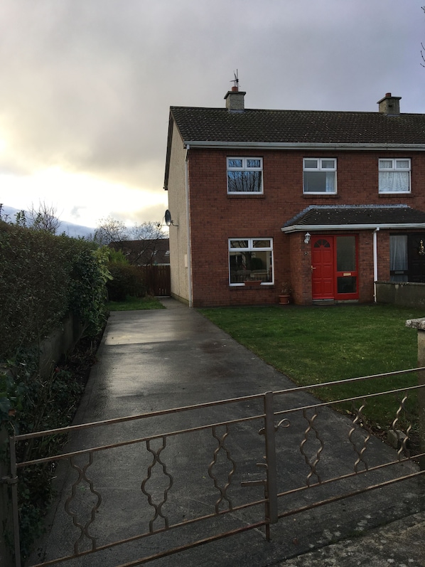 House front, driveway and garden