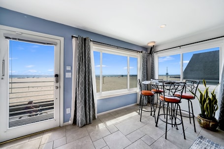 View of dining area and beach views from living room