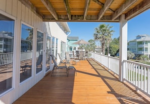 Large deck with porch swing.  Photo taken from the swing.