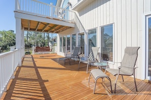 Extremely large second floor deck and third floor sun bathing deck.