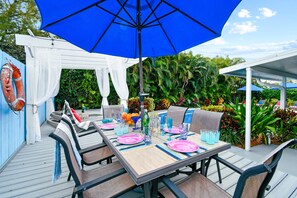 Step into our enchanting backyard, a lush sanctuary designed for memorable moments and serene relaxation.