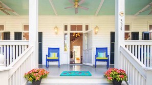A classic front porch graces the facade of the home...