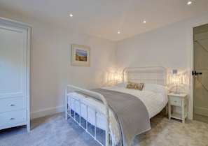 Elegantly decorated master bedroom which has lovely river views