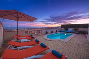Pool area early evening as the is sun going down. Beautiful.