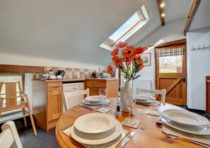 Kitchen/dining room with space for four around the dining table