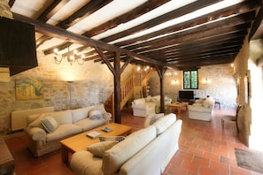 Very large lounge, with 4 sofas, satellite English and French TV, and hifi.