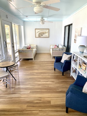 This is the sun room. The door on the left goes to the screened in porch.