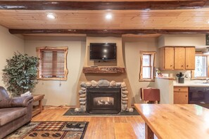 Beautiful, welcoming gas fireplace in the main level living room.