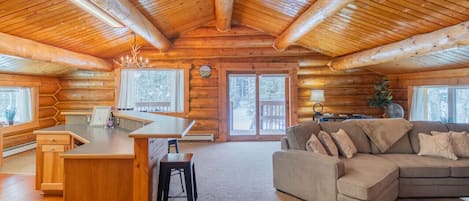 Rich Log Interior with an Open Floor Plan