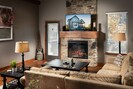 Spacious main level living area with 55" HD TV and remote controlled fireplace.