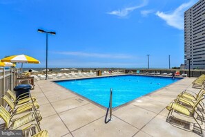 Pool off Huge Deck beside kiddie pool and Tiki Bar and Deck Bathrooms.