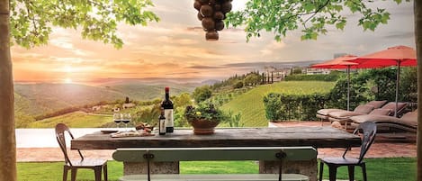 Outdoor Dining Area - An expansive outdoor terrace offers postcard views of Vertine Castle and the surrounding vineyards stretching toward the horizon.