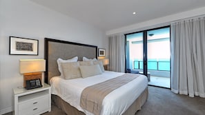 Master bedroom with King bed, ensuite, and ocean views