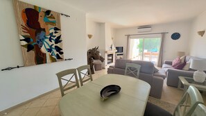 Main lounge/ dining area. Air conditioned with electric shutters.