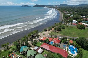 Drone aerial photo of Jaco Beach taken from above Blue Macaw