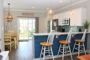 Flow into the kitchen with bar seating