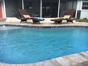 Relaxing in this totally private backyard with your own pool!