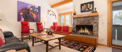 Living Room with Wood Fireplace, Window Seat and Deck